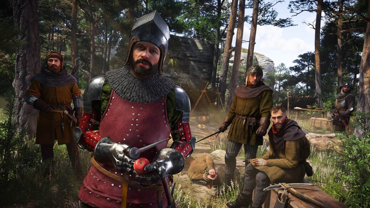 Henry in red and steel armor standing with soldiers in a forest camp in Kingdom Come: Deliverance II