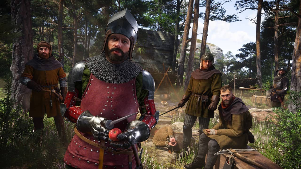 Henry in red and steel armor standing with soldiers in a forest camp in Kingdom Come: Deliverance II