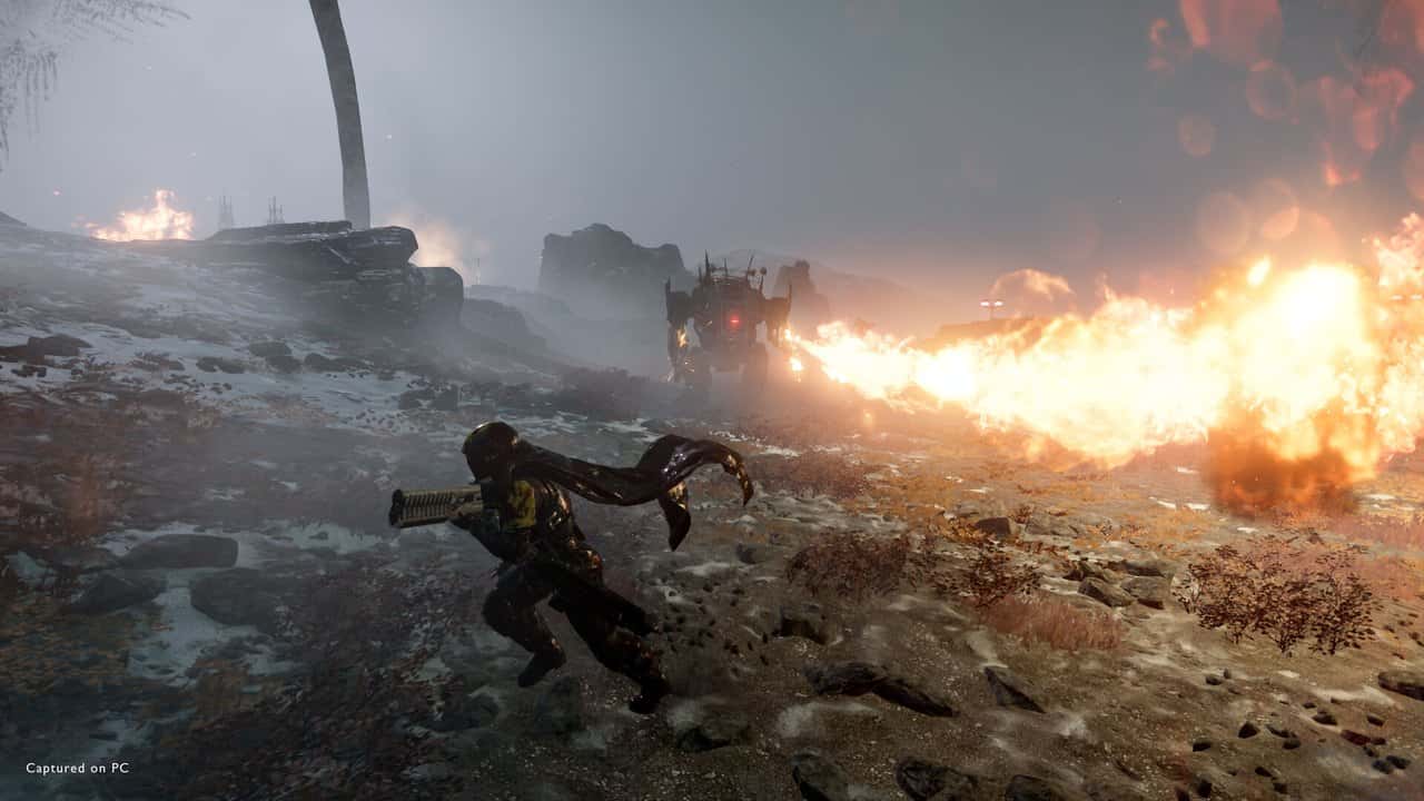 A Helldiver using a flamethrower on a snowy battlefield in Helldivers 2