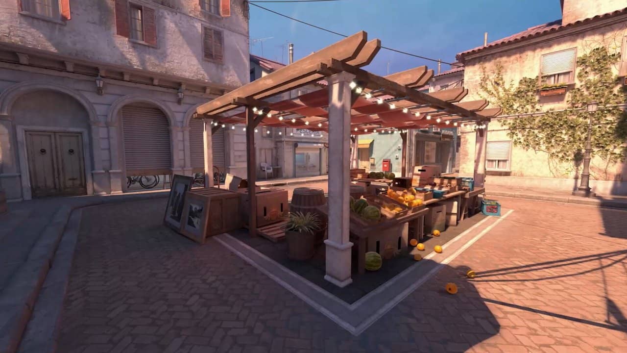 A Mediterranean-style Counter-Strike 2 map with a wooden pergola courtyard and stone houses