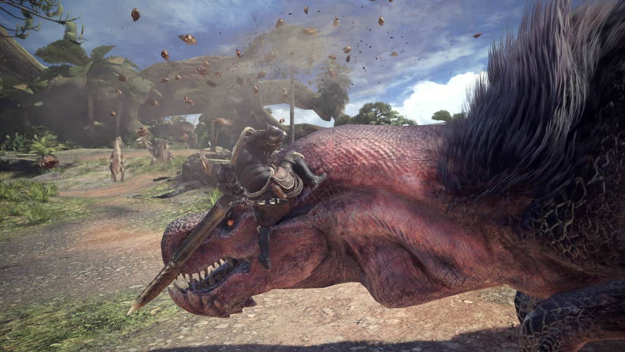 A huge pink-furred monster roaring in a forest clearing in Monster Hunter: World