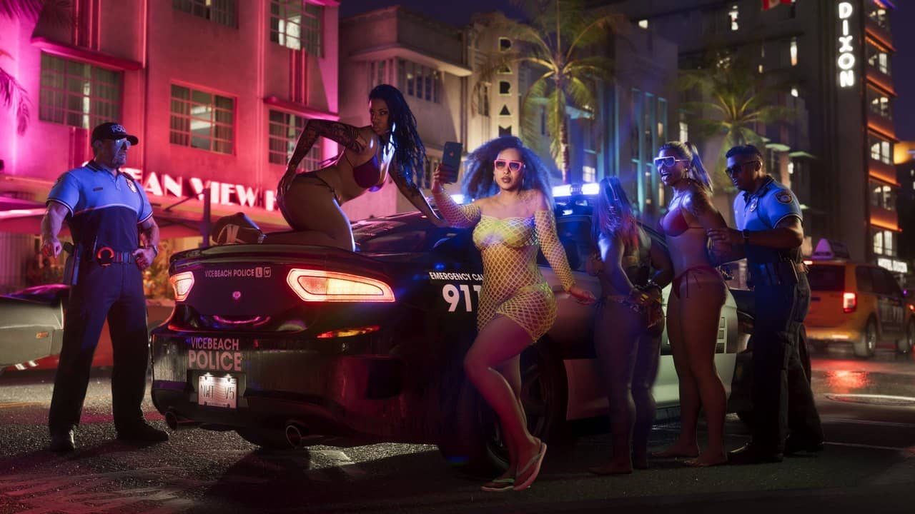 Police officers beside a patrol car under neon lights at night in Vice City, official GTA 6 screenshot